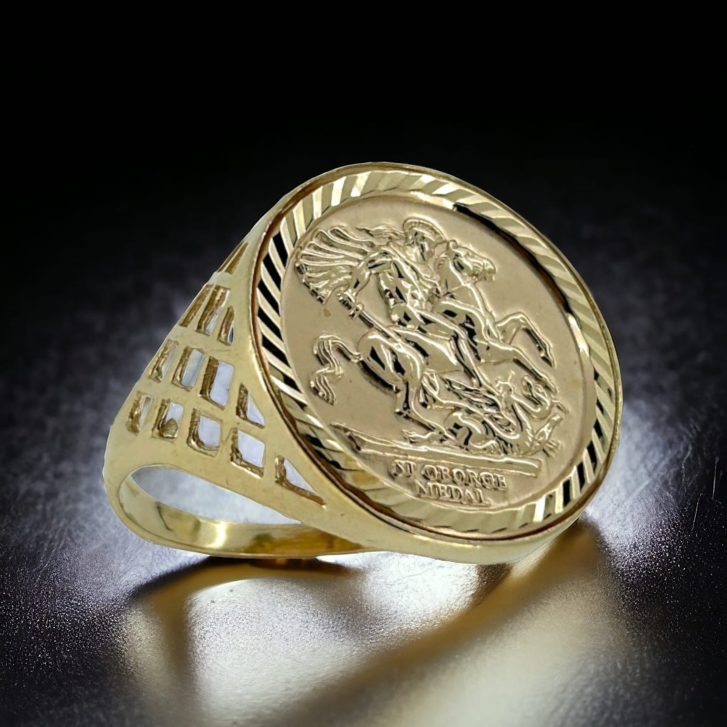9ct gold sovereign ring on a black table