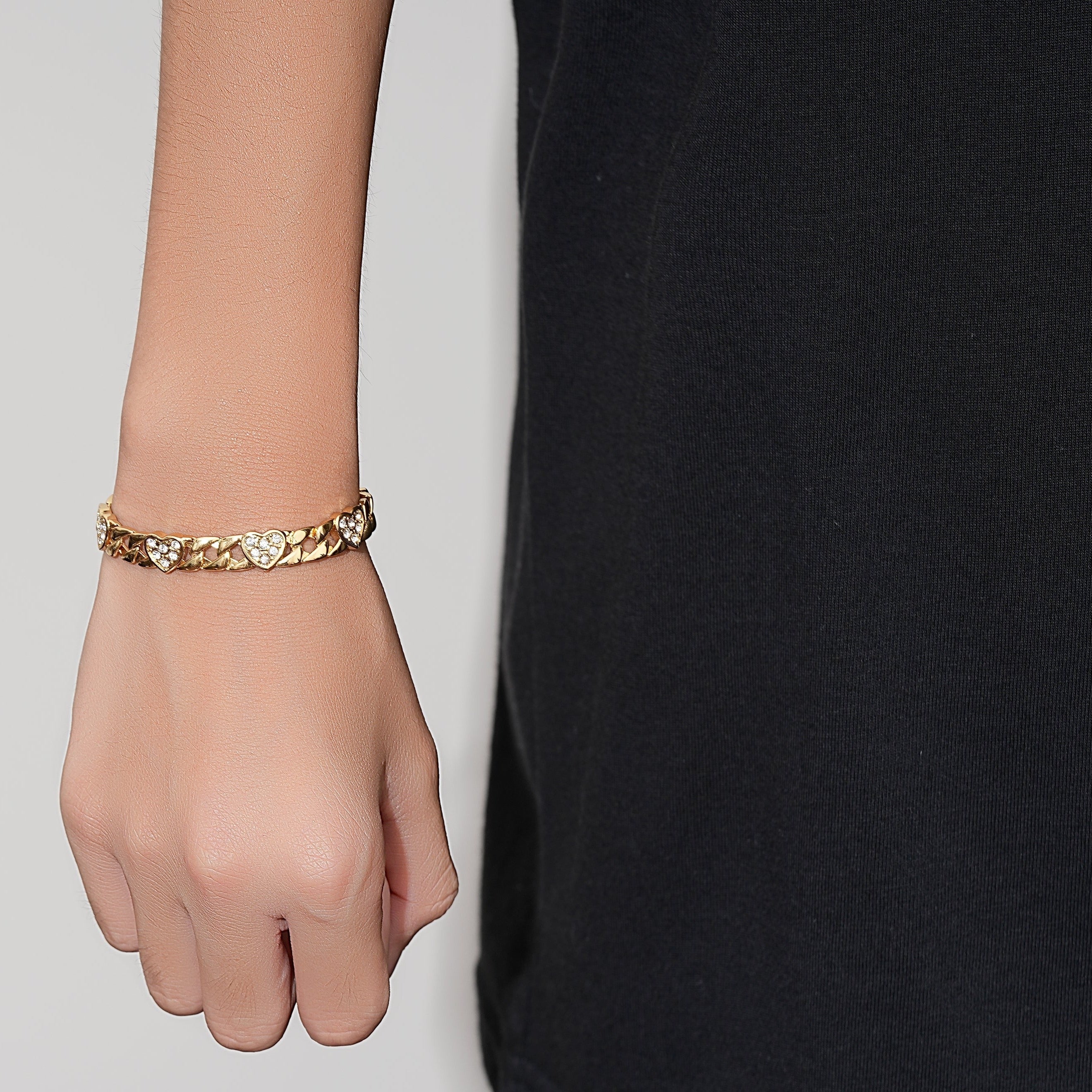 Lightweight gold bracelet with heart charm, 6-inch, 7mm, 11 grams.