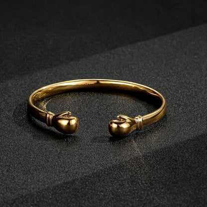 Gold boxing bangle bracelet, 7.5-8 inches, 4mm band width, 28 grams.