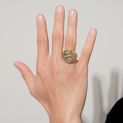 Shiny gold bonded ring with a sovereign emblem